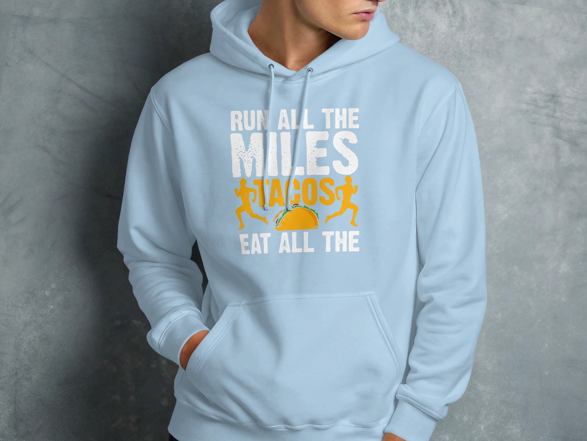 Light blue hoodie with "Run All the Miles Eat All the Tacos" text and taco graphic.