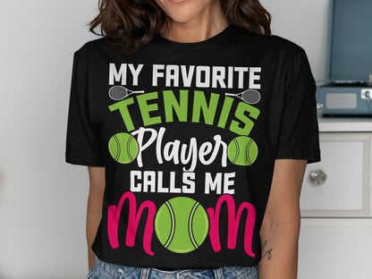 Black t-shirt with "My Favorite Tennis Player Calls Me Mom" text and tennis imagery.