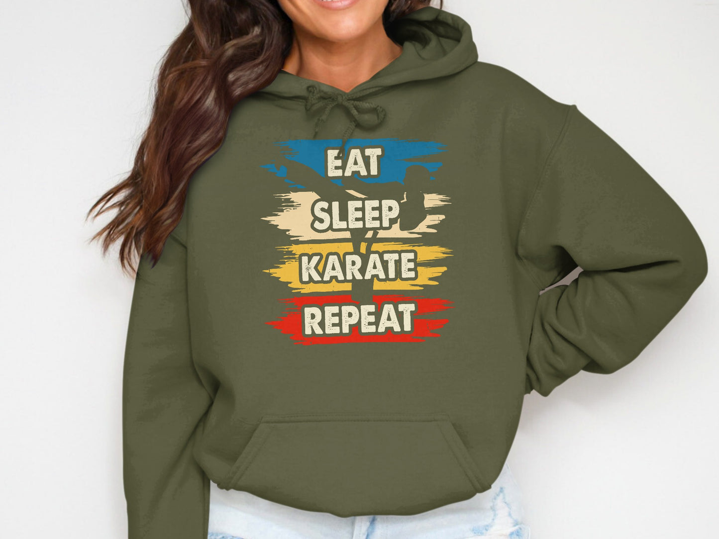 Olive green hoodie with "Eat Sleep Karate Repeat" text in colorful stripes.