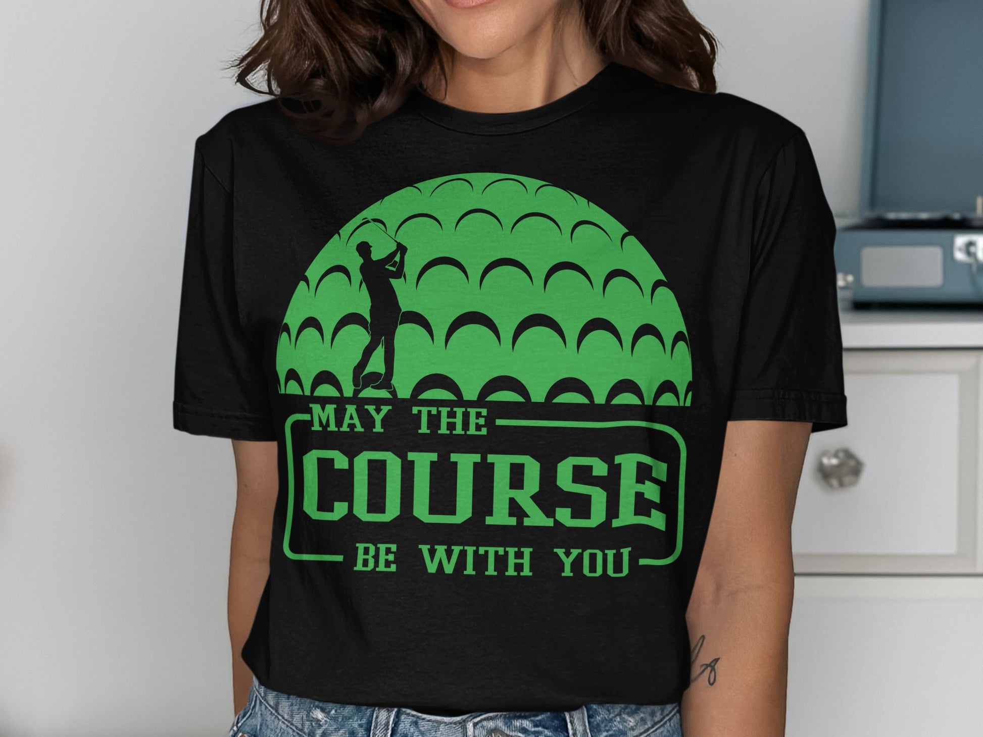 Black t-shirt with a golfer and "May the Course be With You" text.