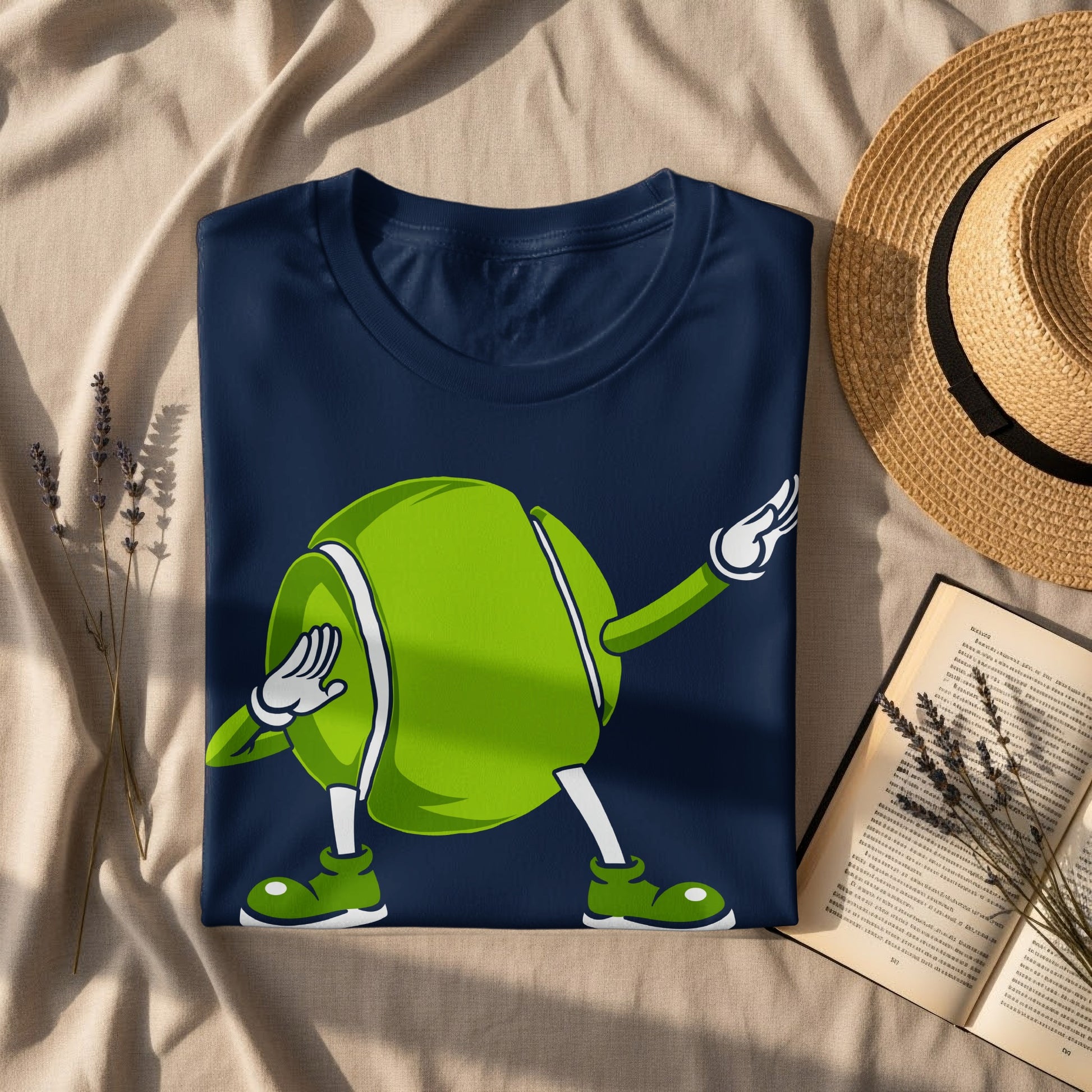 Navy t-shirt with a cartoon tennis ball character dabbing.