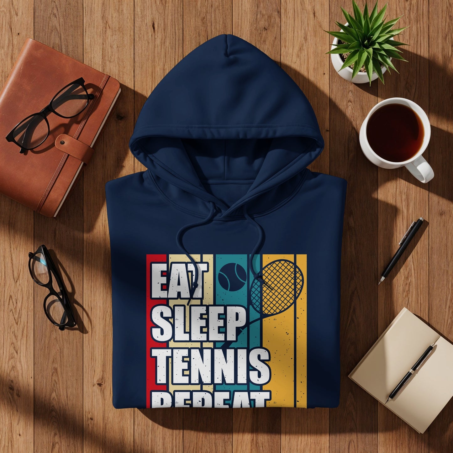 Navy hoodie with "Eat Sleep Tennis Repeat" graphic and tennis racket.