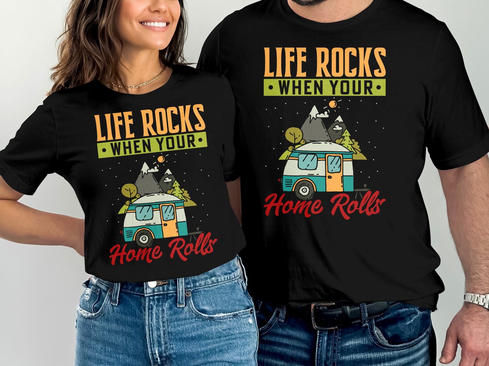Couple wearing black t-shirts with "Life Rocks When Your Home Rolls" graphic.