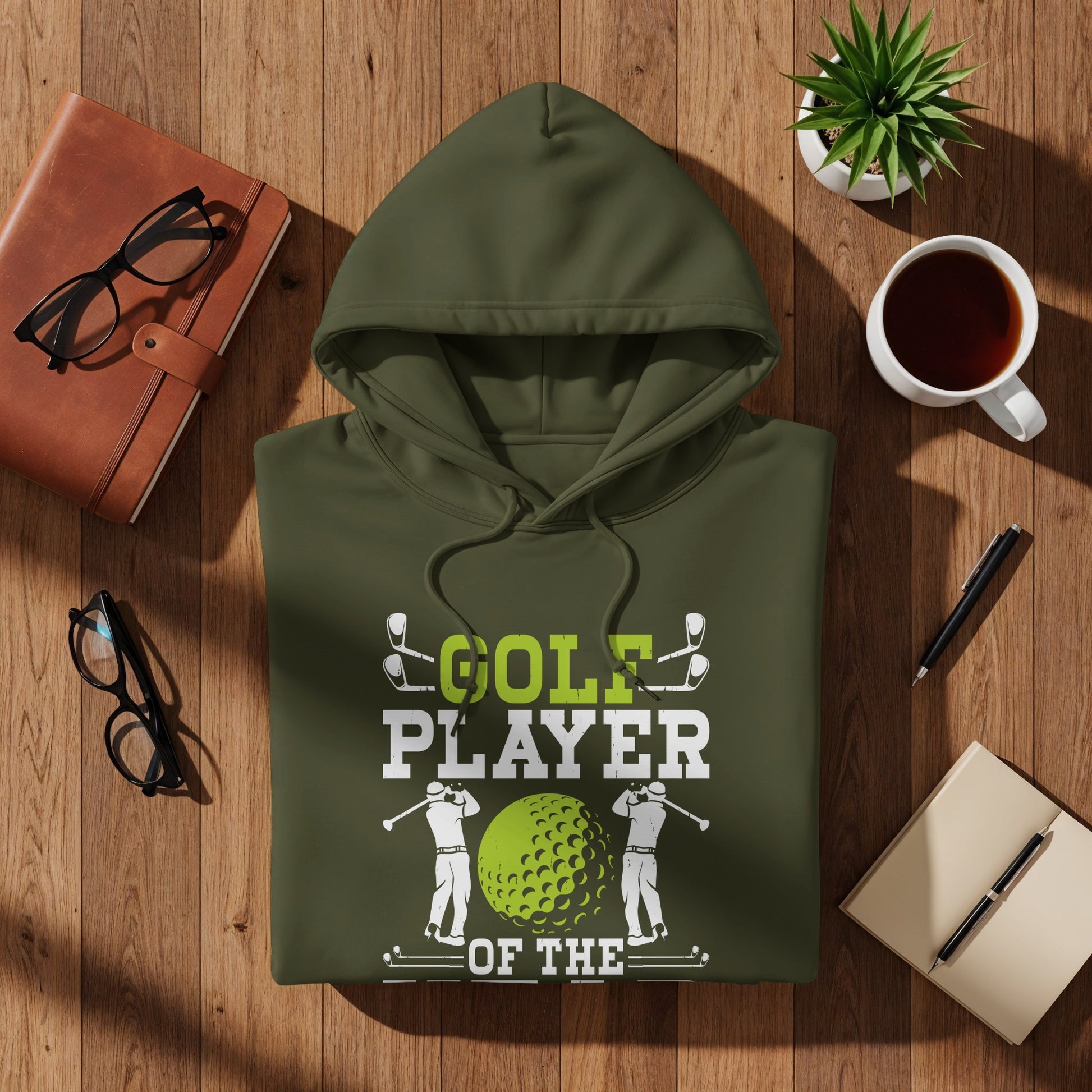 Green hoodie with "Golf Player of the Year" text and golf ball graphic.