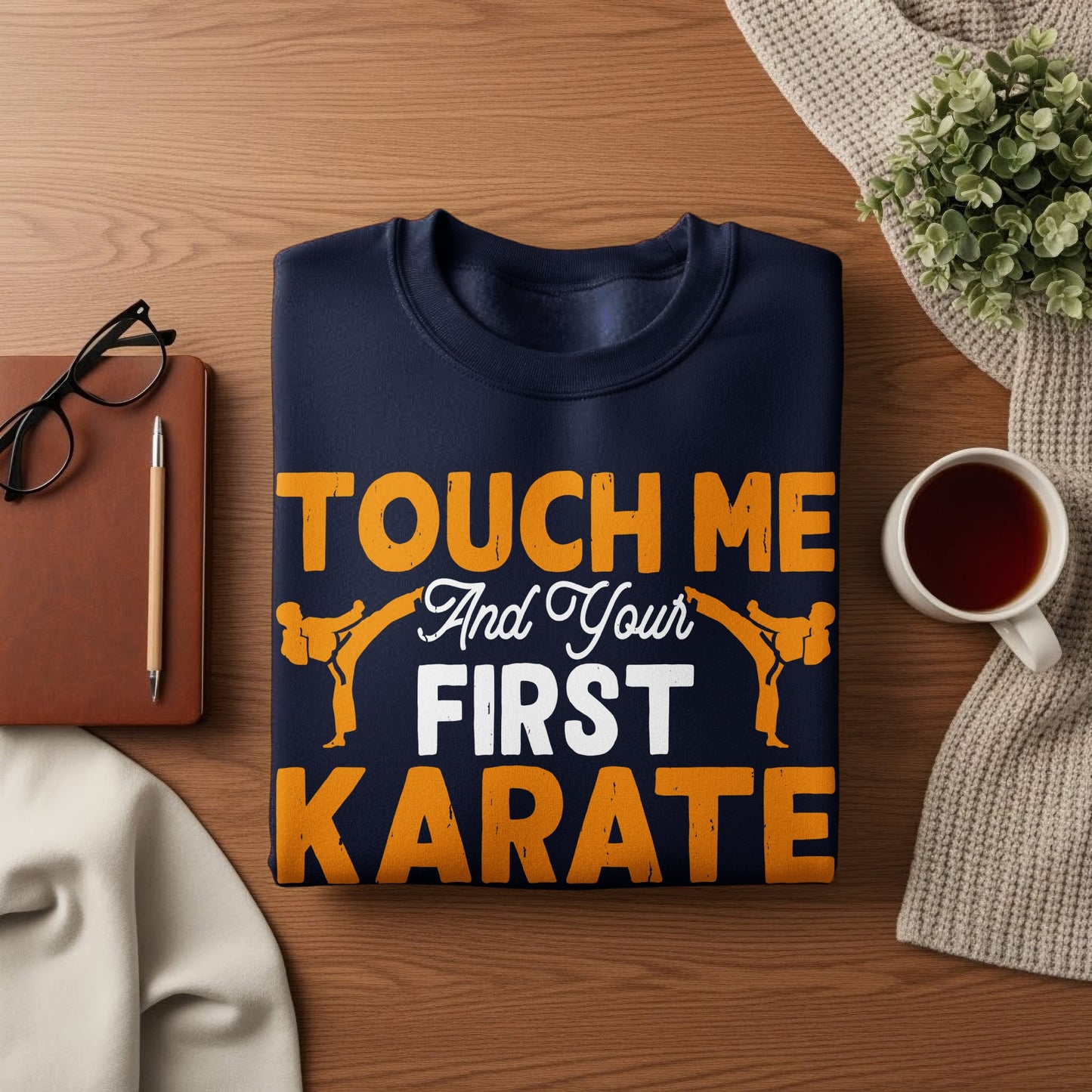 Navy sweatshirt with orange text and karate graphics.