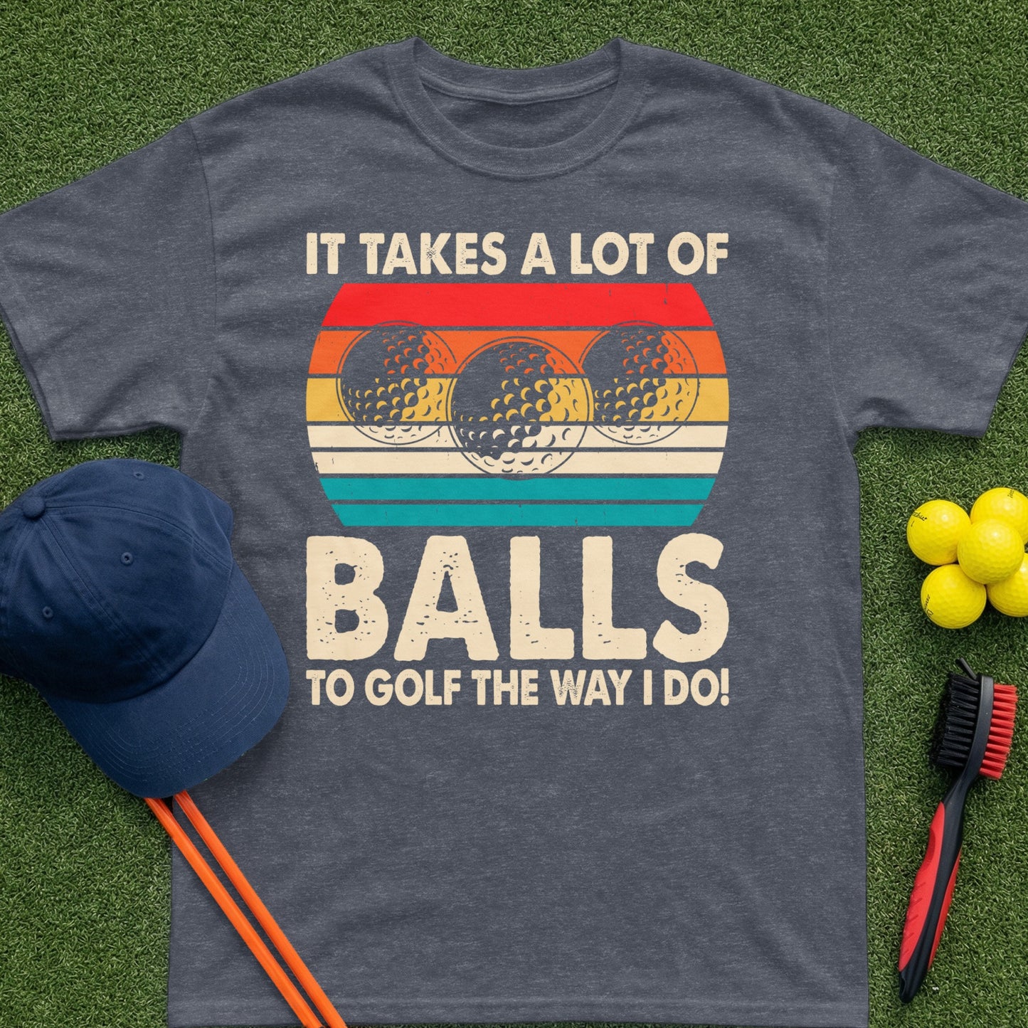 T-shirt with "It takes a lot of balls to golf the way I do!" text and golf balls.