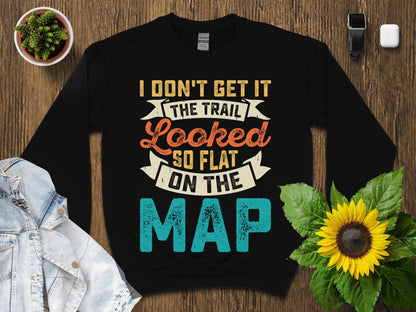 Black sweatshirt with "THE TRAIL LOOKED SO FLAT ON THE MAP" text.