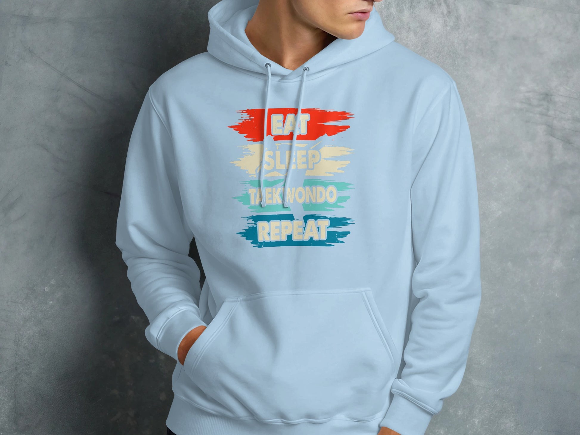 Light blue hoodie with "EAT SLEEP TAEKWONDO REPEAT" text.