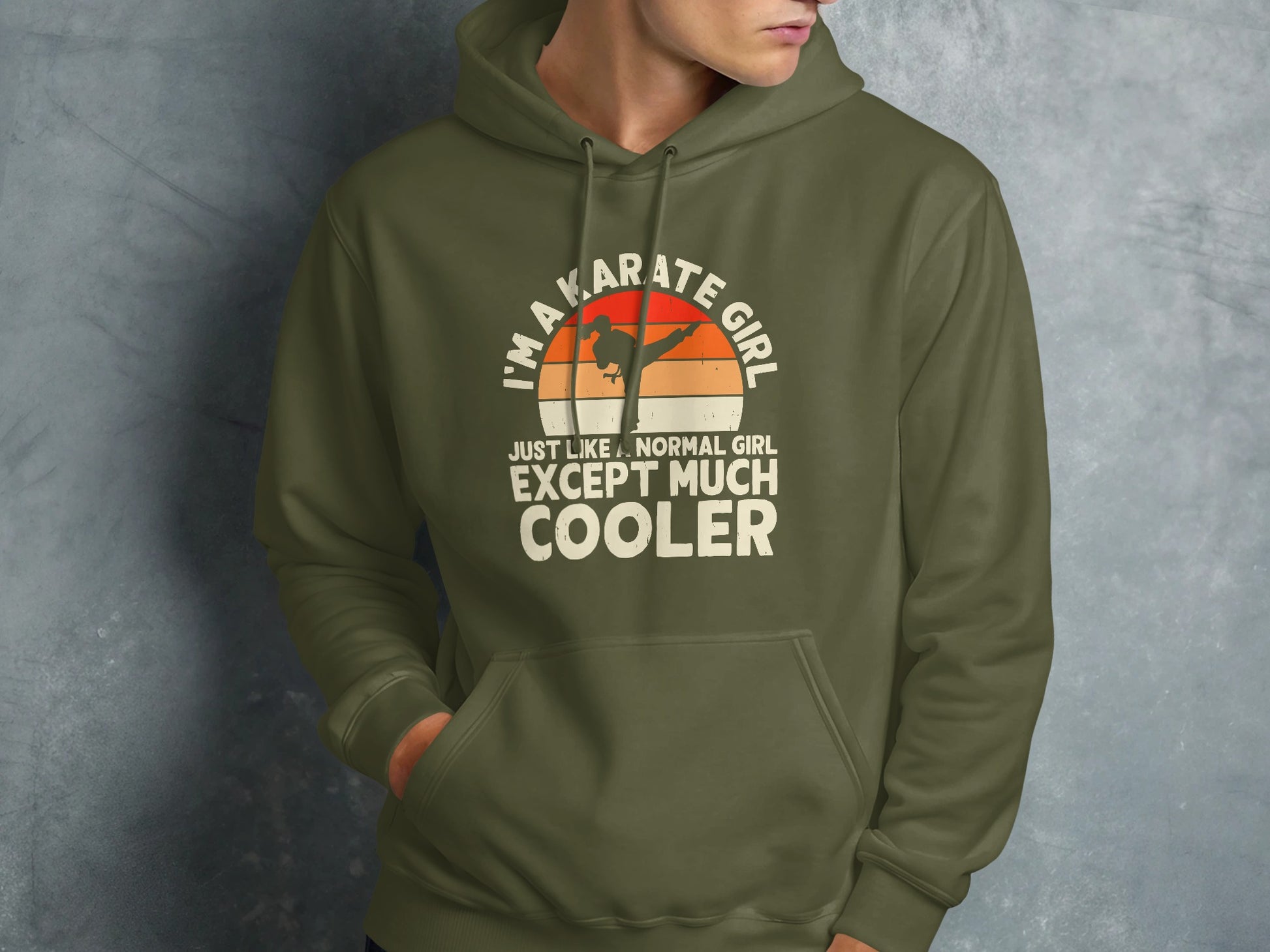 Olive green hoodie with "I'm a karate girl" text and sunset graphic.