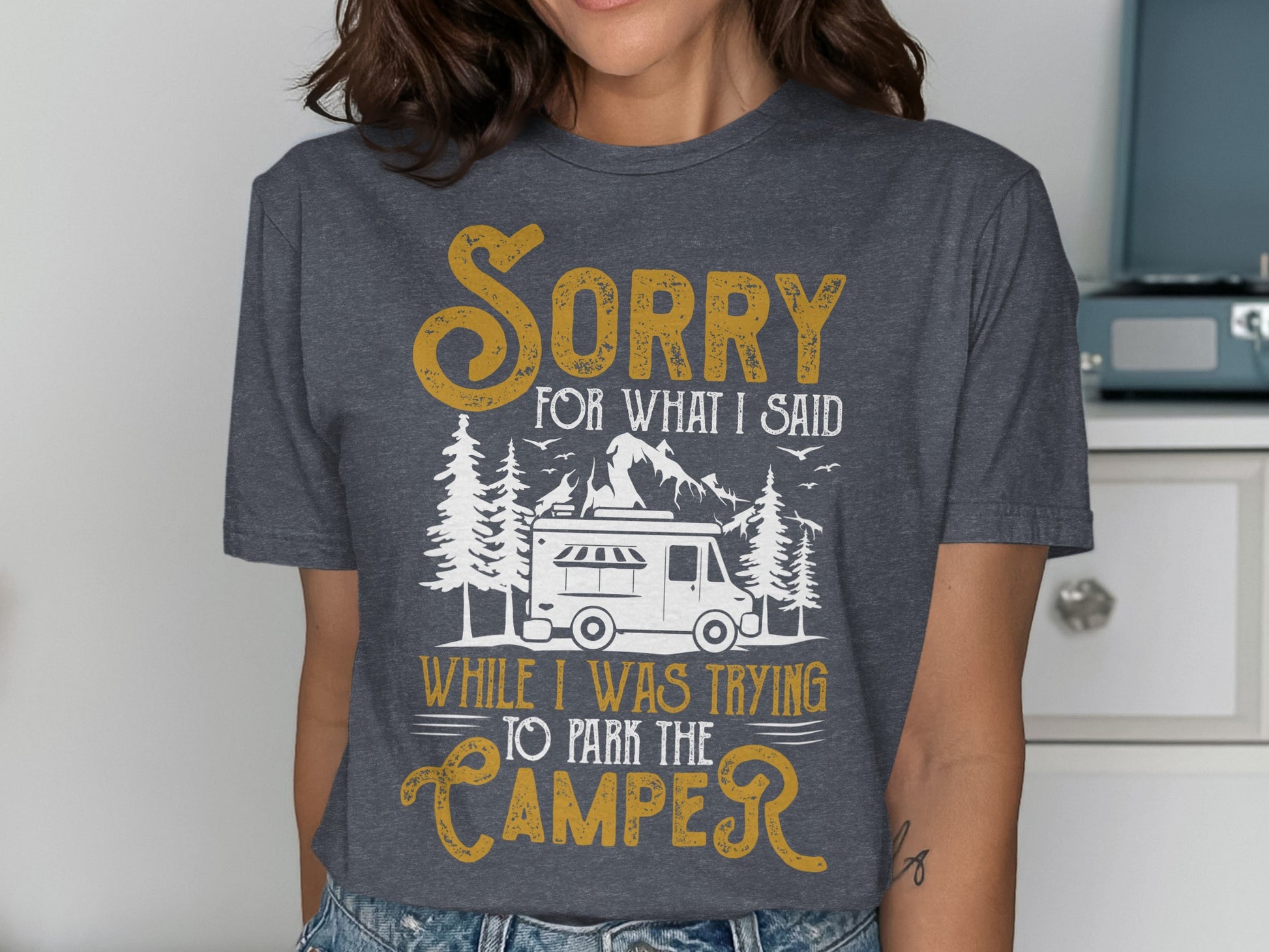 Dark grey t-shirt with "Sorry for what I said while parking the camper" text and graphic.