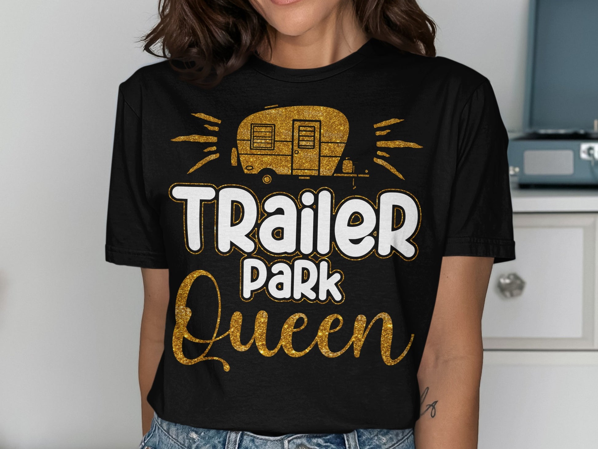 Sparkling gold text "Trailer Park Queen" on a black t-shirt.
