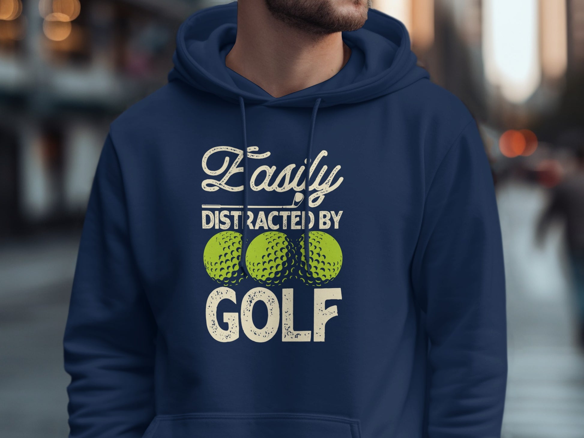 Navy blue hoodie with "Easily Distracted by Golf" text and three golf balls.