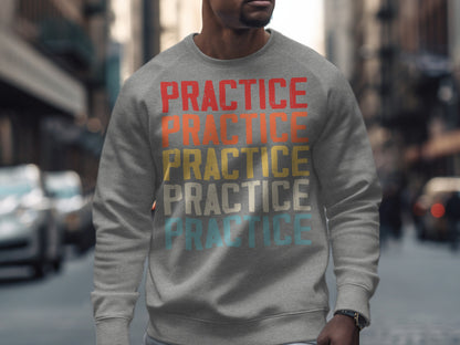 Grey sweatshirt with "PRACTICE" repeated in red, yellow, white, and blue.