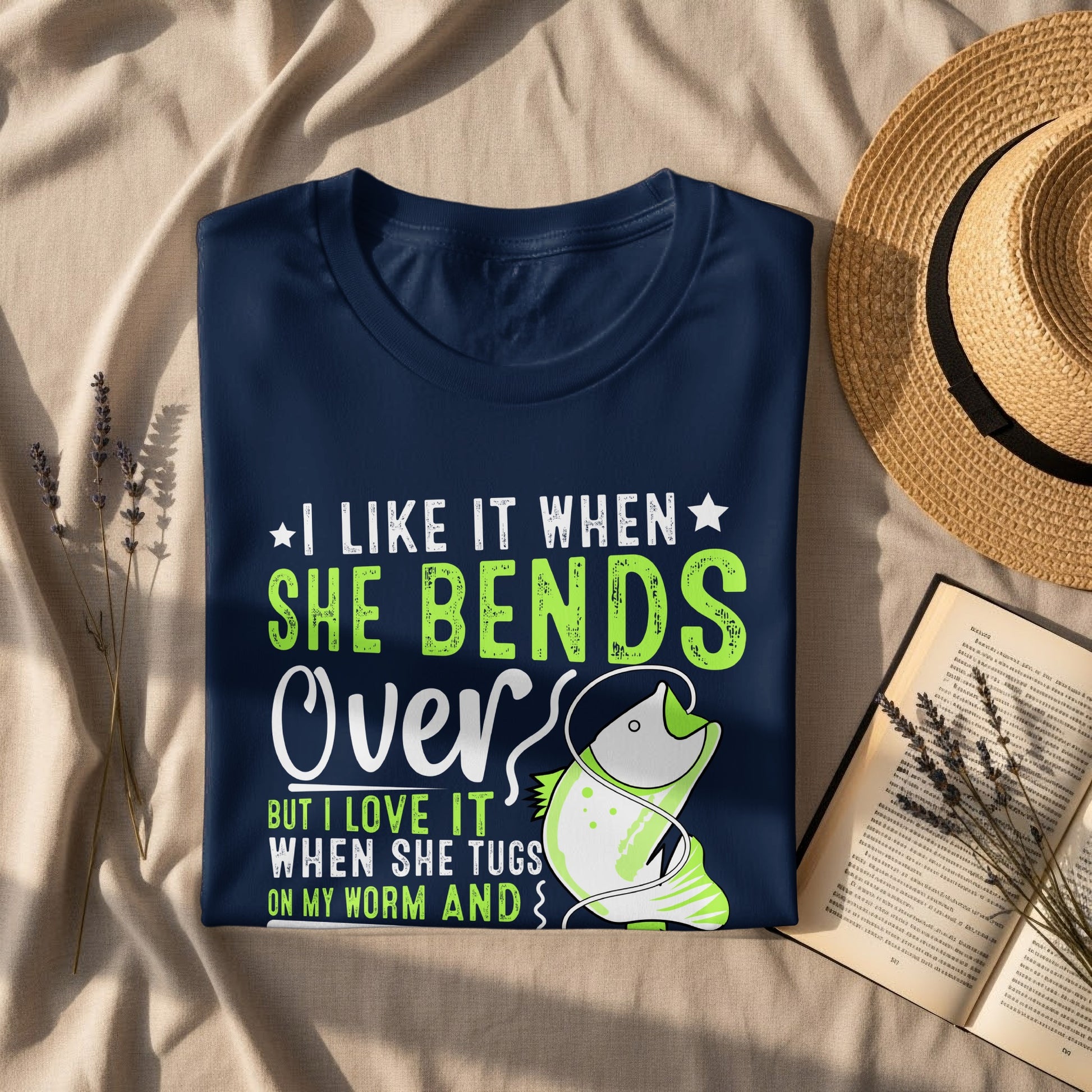 Navy t-shirt with "She Bends Over" and a fishing hook graphic.