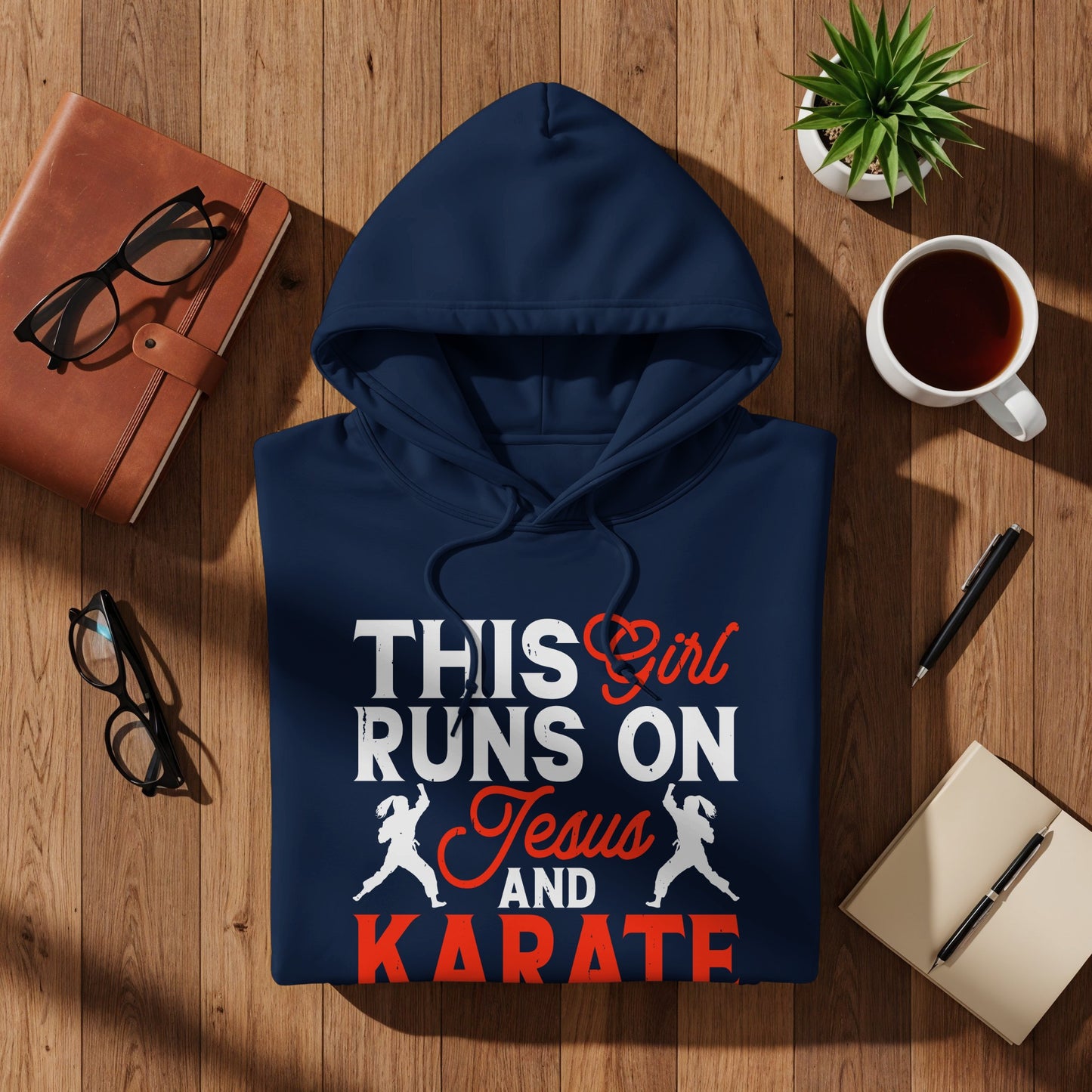 Navy hoodie with "This Girl Runs On Jesus and Karate" text and karate figures.