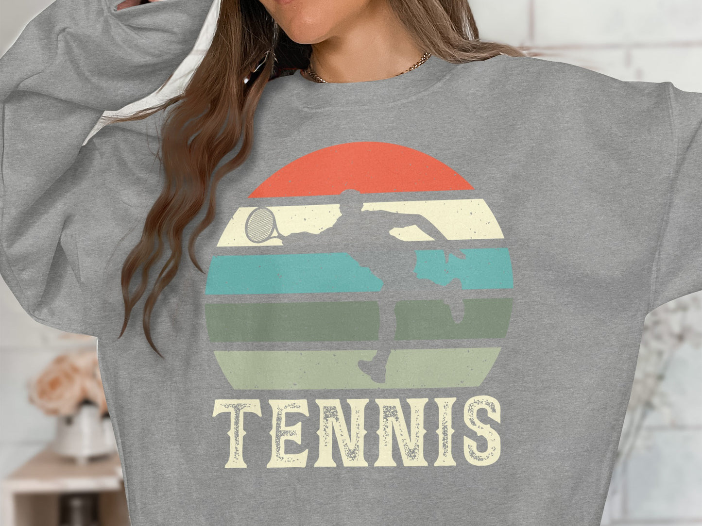 Grey sweatshirt with a vintage tennis player graphic and "TENNIS" text.