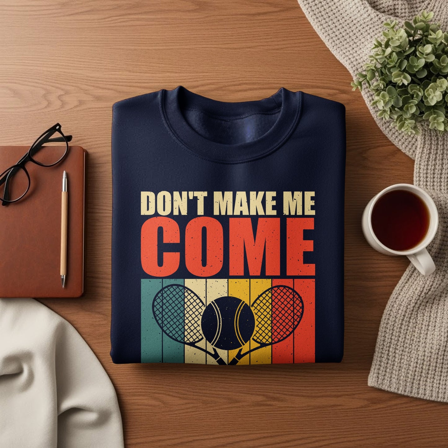 Navy sweatshirt with text "DON'T MAKE ME COME" and tennis rackets.