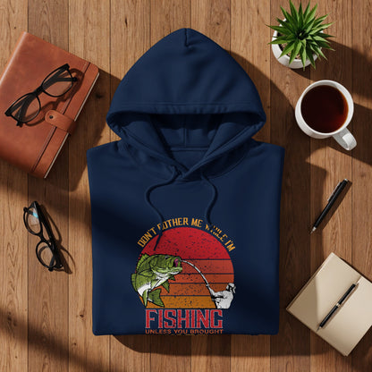 Navy hoodie with "Don't Bother Me While I'm Fishing" graphic.