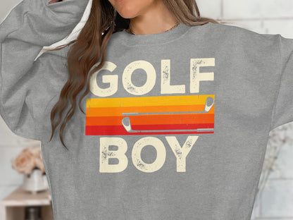 Gray sweatshirt with "GOLF BOY" text and colorful golf club graphic.