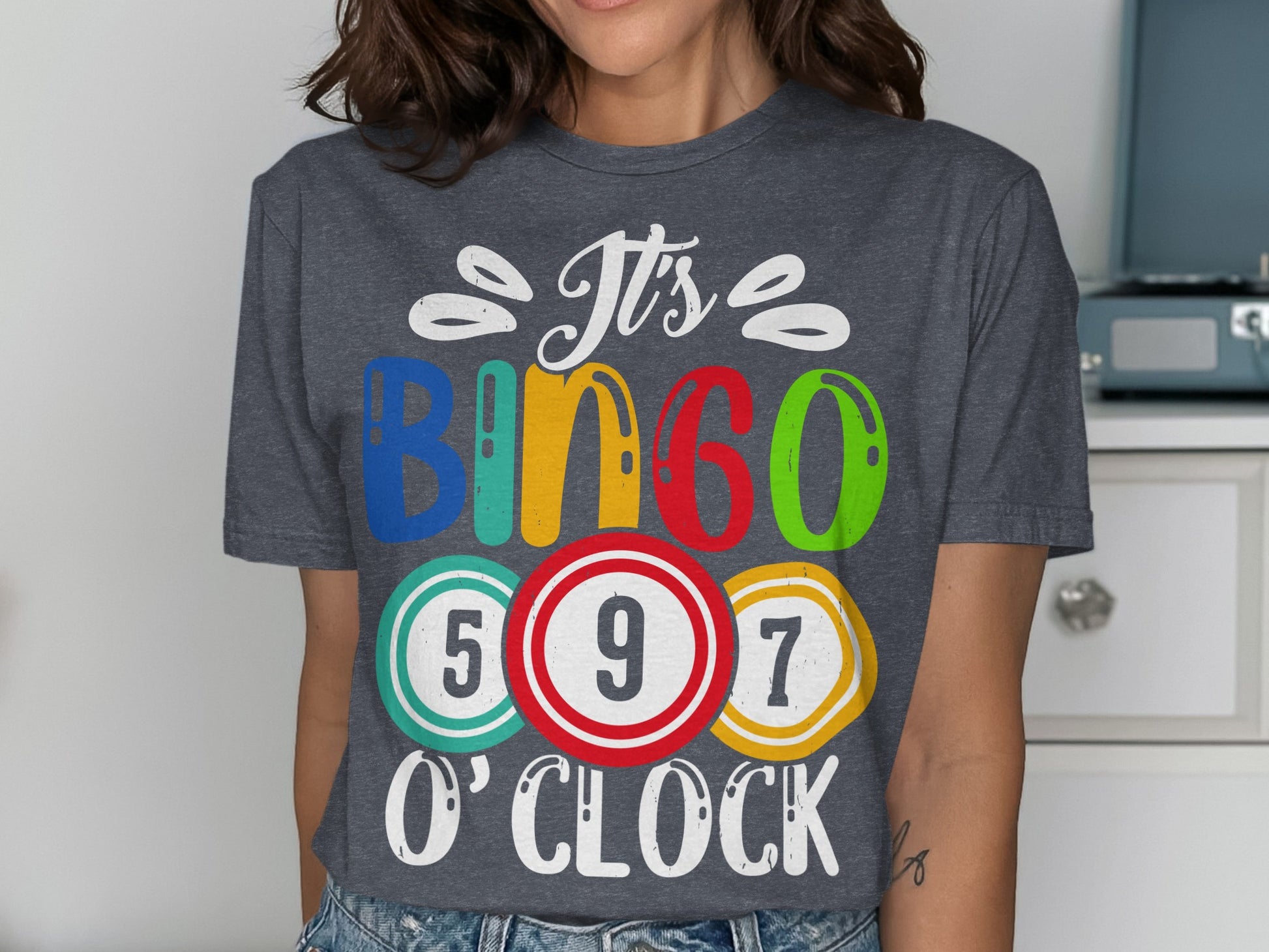 Dark gray t-shirt with "It's Bingo O'Clock" and colorful bingo balls.