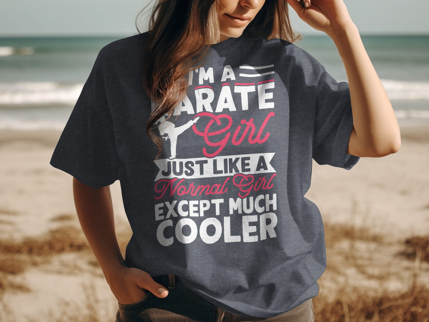 Woman wearing dark grey t-shirt with "Karate Girl" graphic.