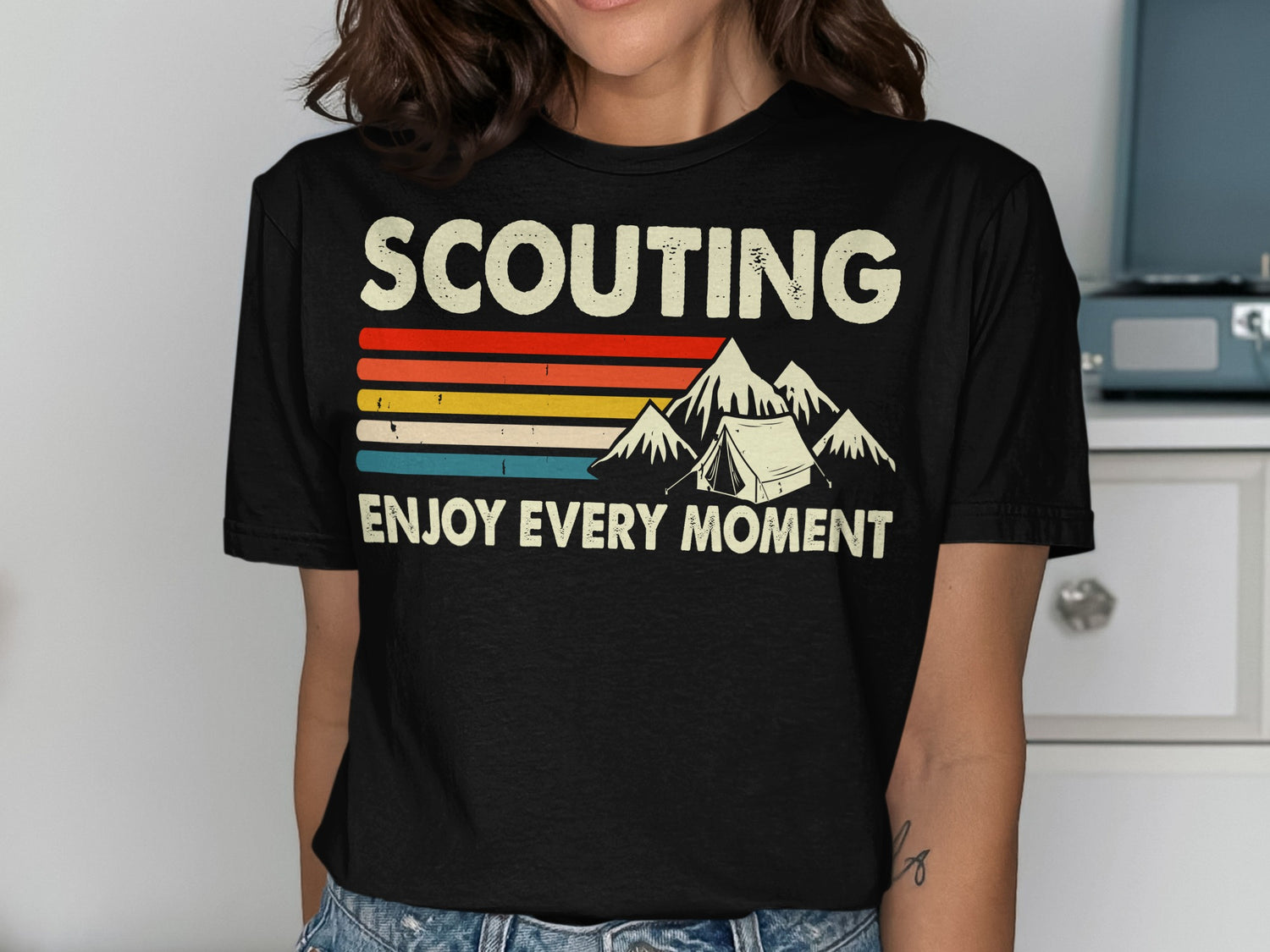 Scouting Enjoy Every Moment text with mountains and tent graphic.