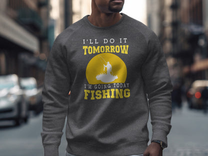 Man wearing grey sweatshirt with text "I'll do it tomorrow, I'm going fishing".