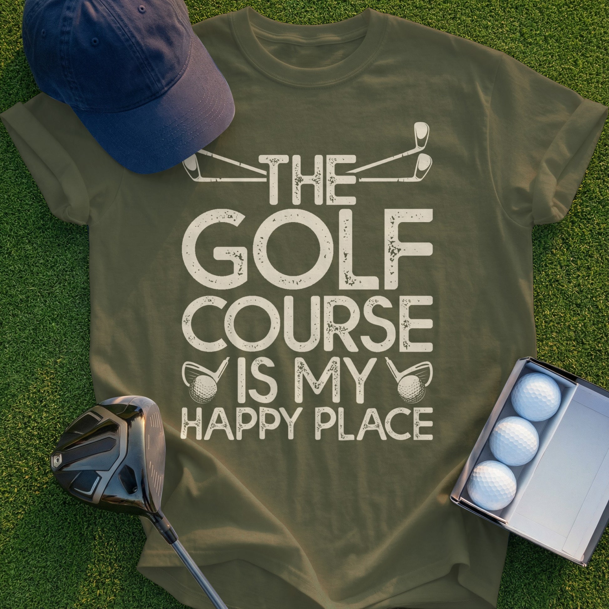 Olive green t-shirt with "The Golf Course Is My Happy Place" text and golf graphic.