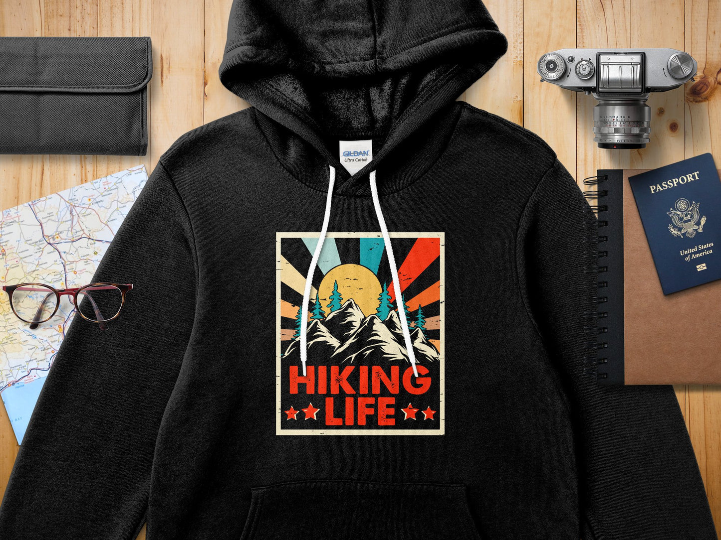 Black hoodie with "Hiking Life" retro sunset graphic design.