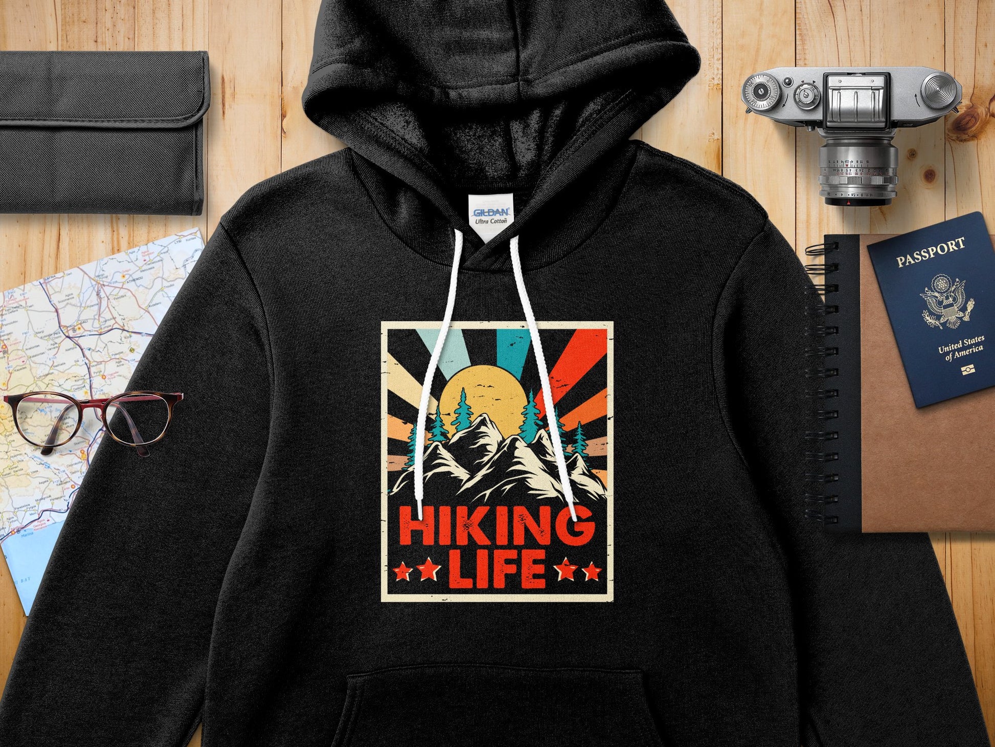 Black hoodie with "Hiking Life" retro sunset graphic design.