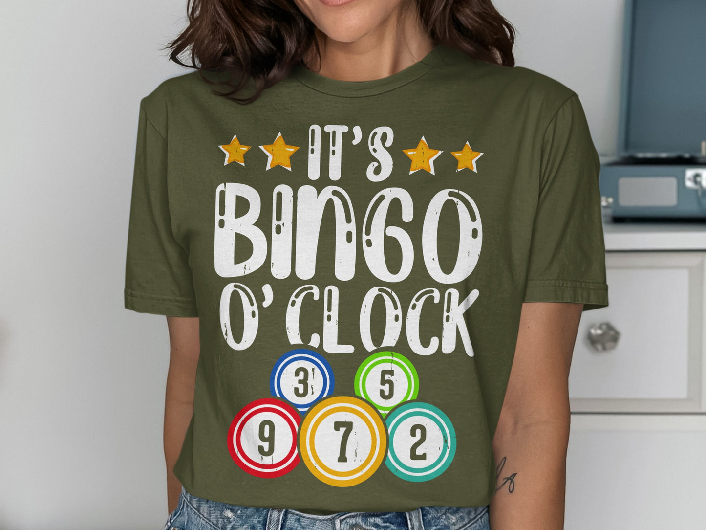 Green t-shirt with "IT'S BINGO O'CLOCK" and bingo balls.