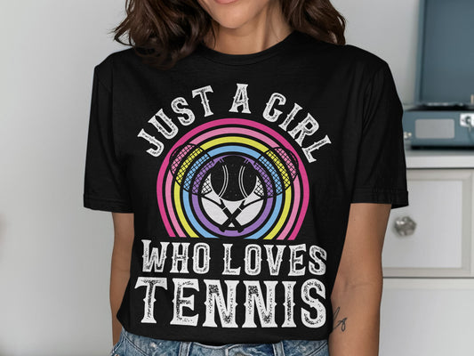 Black t-shirt with rainbow tennis rackets and "JUST A GIRL WHO LOVES TENNIS" text.