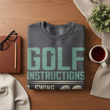 Dark gray sweatshirt with "GOLF INSTRUCTIONS 1 SWING" graphic.