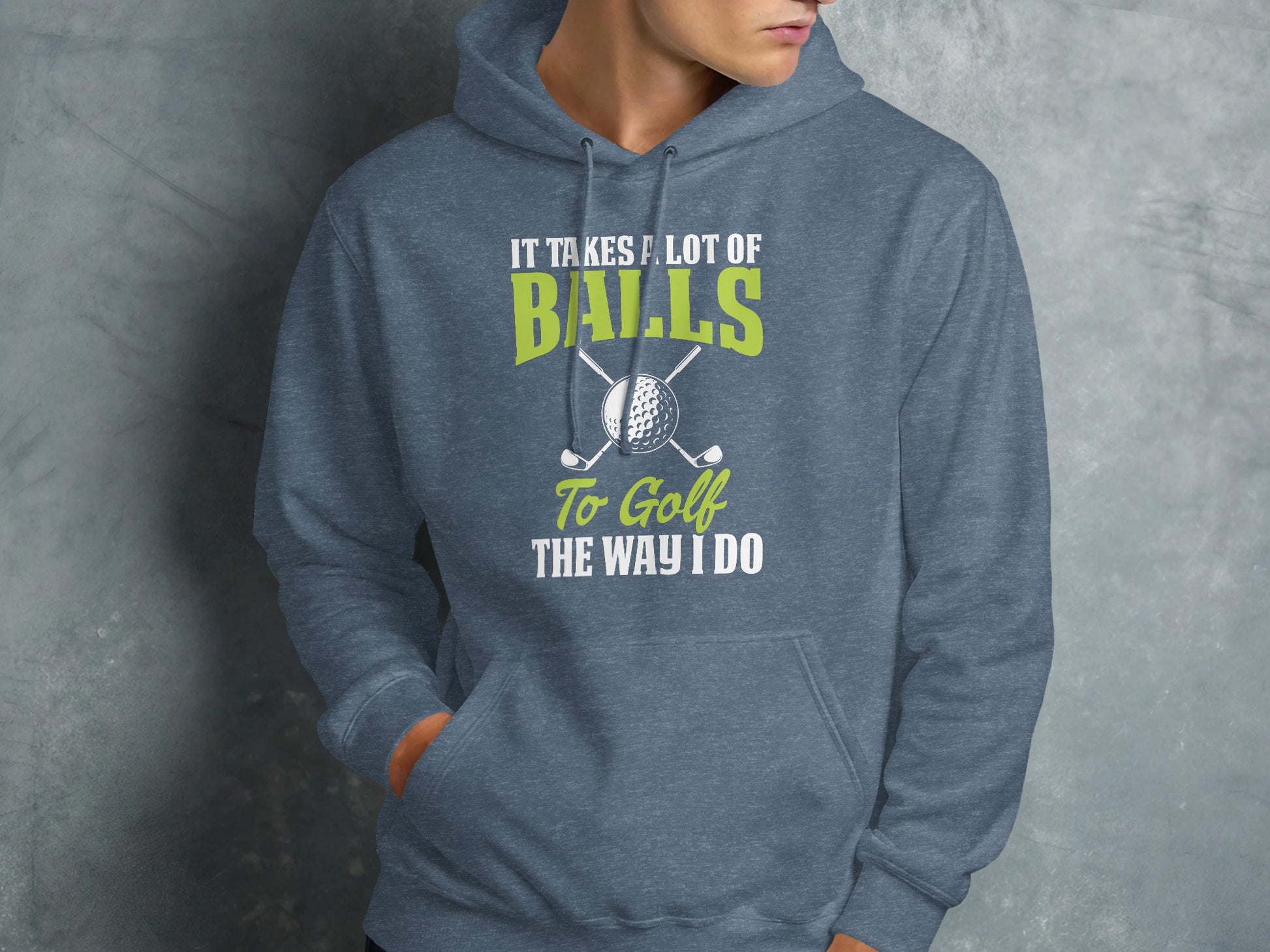 Grey hoodie with "It Takes A Lot Of Balls To Golf The Way I Do" text and golf clubs.