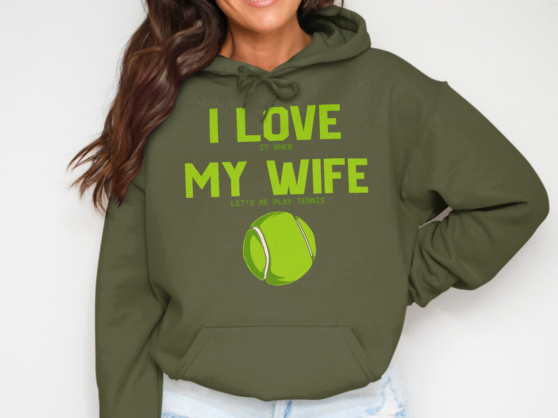 Green hoodie with "I LOVE IT WHEN MY WIFE LETS ME PLAY TENNIS" and a tennis ball.