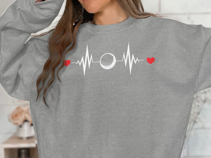 Gray sweatshirt with a heartbeat graphic featuring a golf ball.