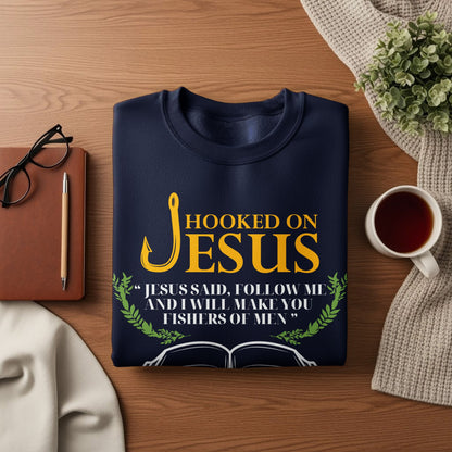 Dark blue sweatshirt with "Hooked on Jesus" and Bible verse about fishing for men.