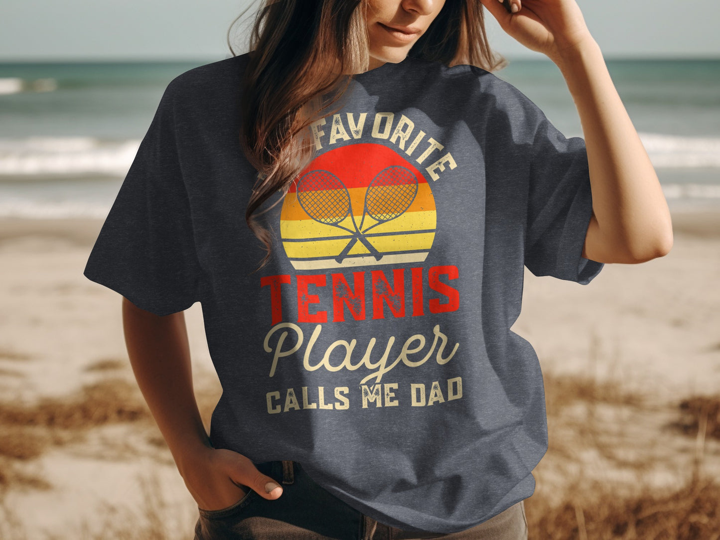 T-shirt with "Favorite Tennis Player Calls Me Dad" and tennis rackets.
