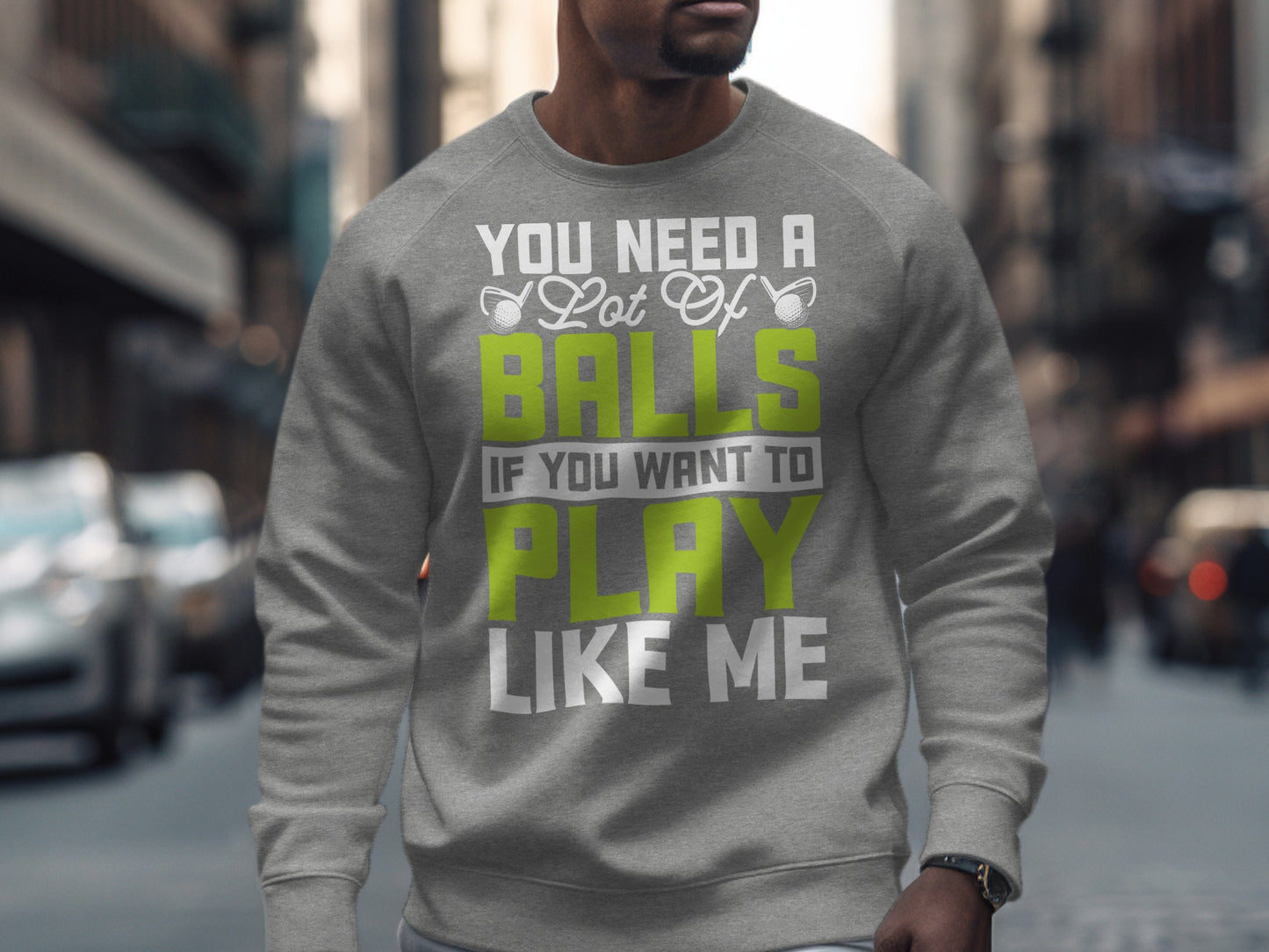 Grey sweatshirt with "You need a lot of balls if you want to play like me" text.