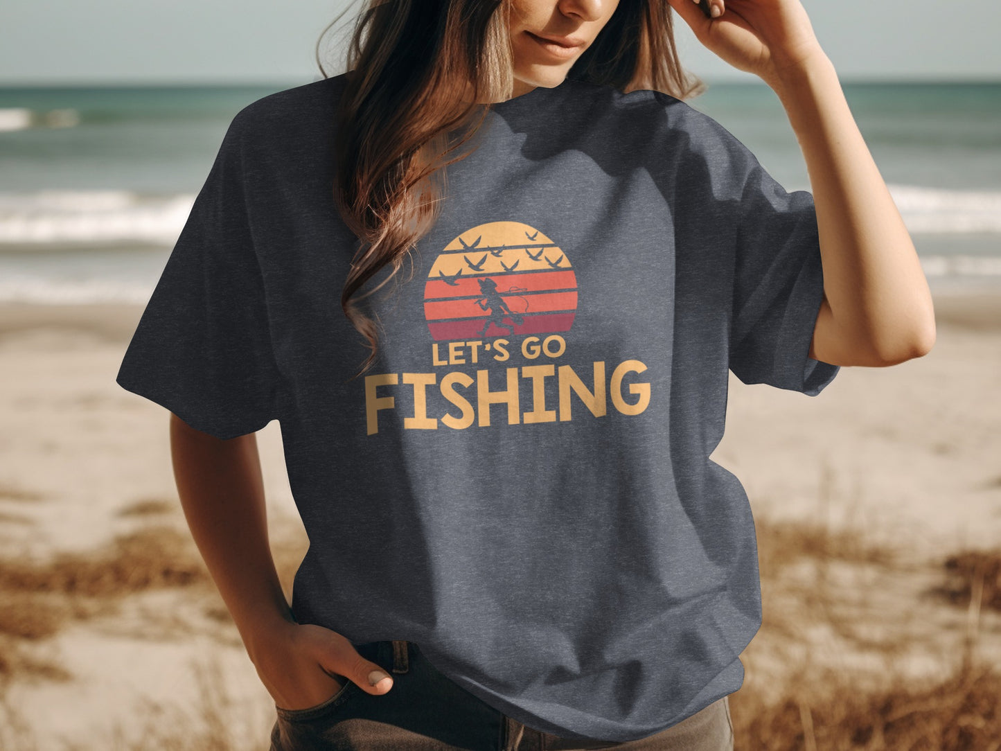 Dark t-shirt with "Let's Go Fishing" text and a sunset graphic.