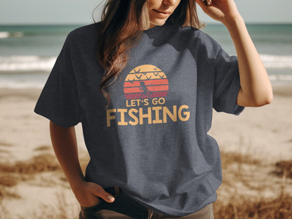 Dark t-shirt with "Let's Go Fishing" text and a sunset graphic.