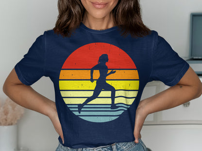Navy t-shirt with a runner silhouette against a colorful retro sunset graphic.