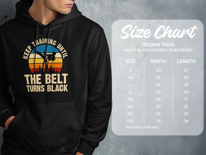 Hooded sweatshirt with "Keep Training Until The Belt Turns Black" graphic and size chart.