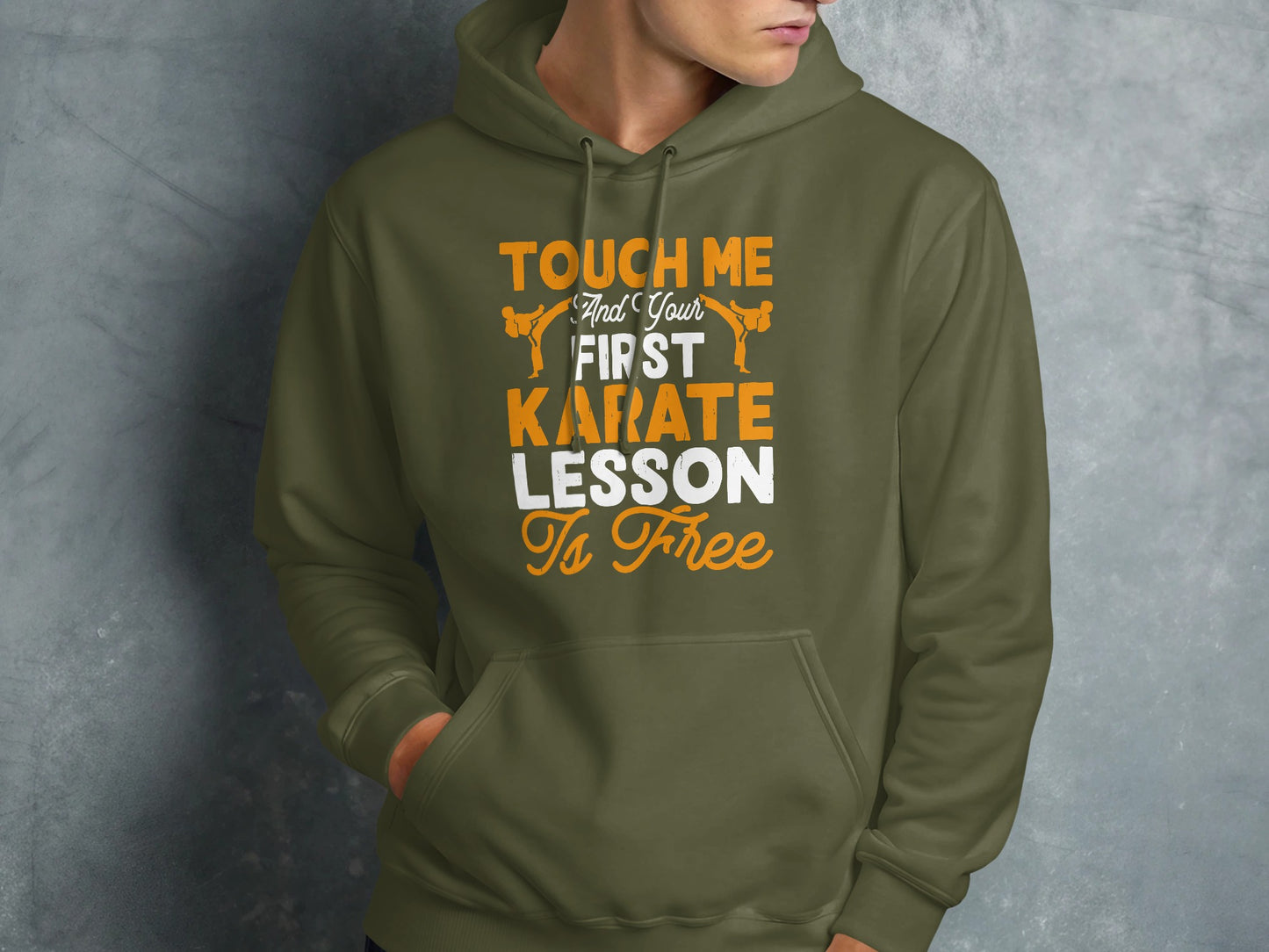 Olive green hoodie with orange text "Touch Me and Your First Karate is Free".