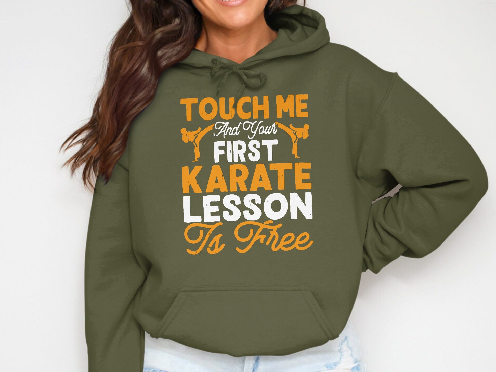 Olive green hoodie with "Touch Me And Your First Karate Lesson Is Free" text.