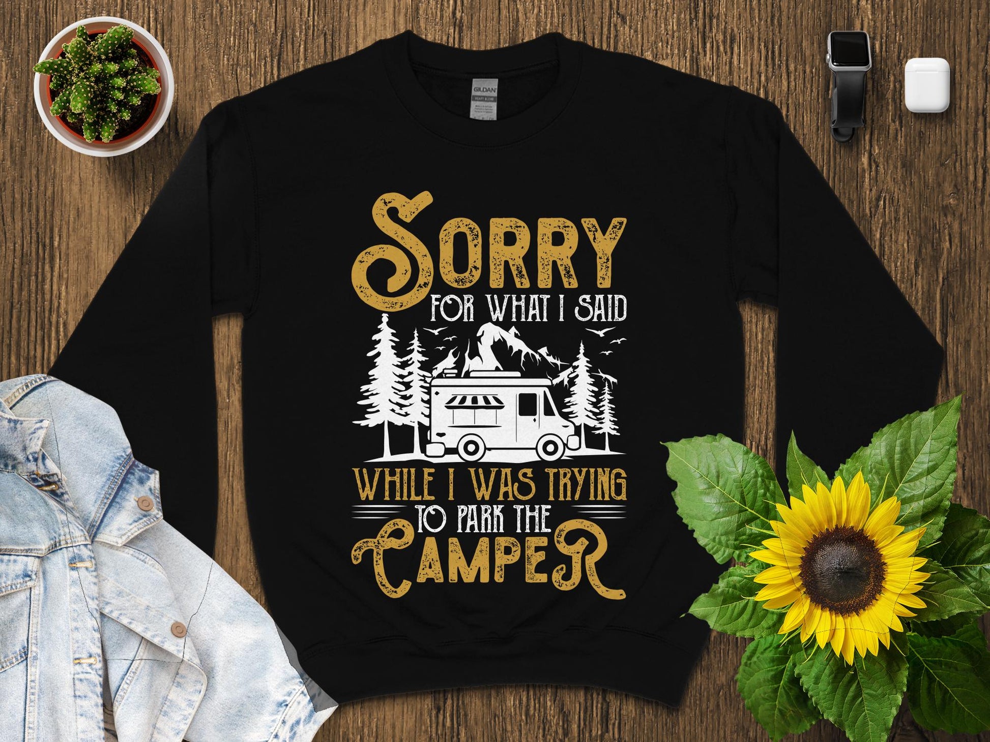 Black sweatshirt with "Sorry for what I said while I was trying to park the camper" text.