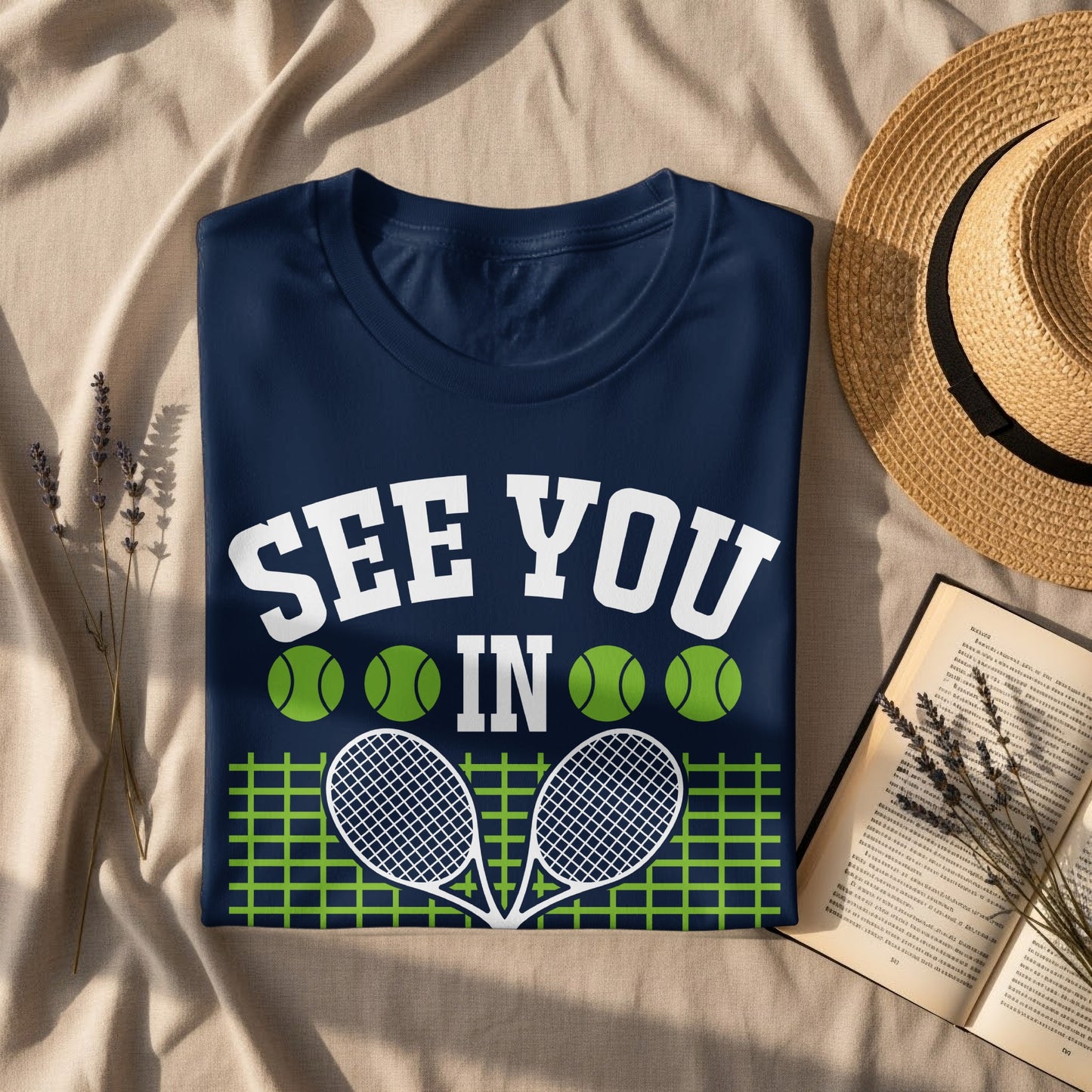 Navy t-shirt with "SEE YOU IN" and tennis graphics.