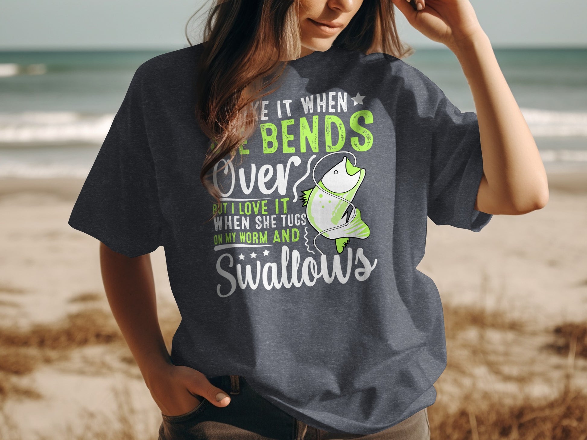T-shirt with text "I love it when she tugs on my worm and swallows."