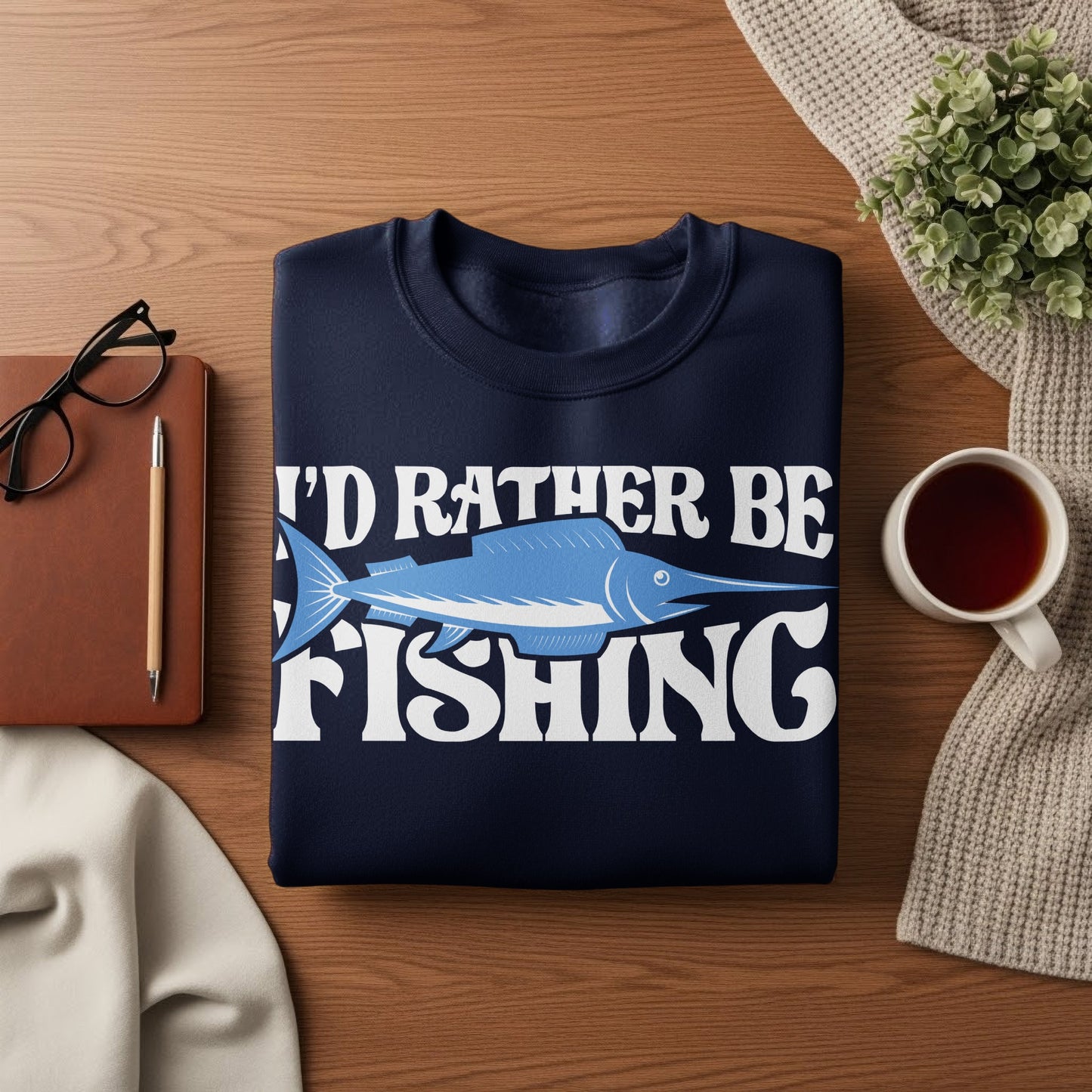 Dark blue sweatshirt with "I'd rather be fishing" text and fish graphic.
