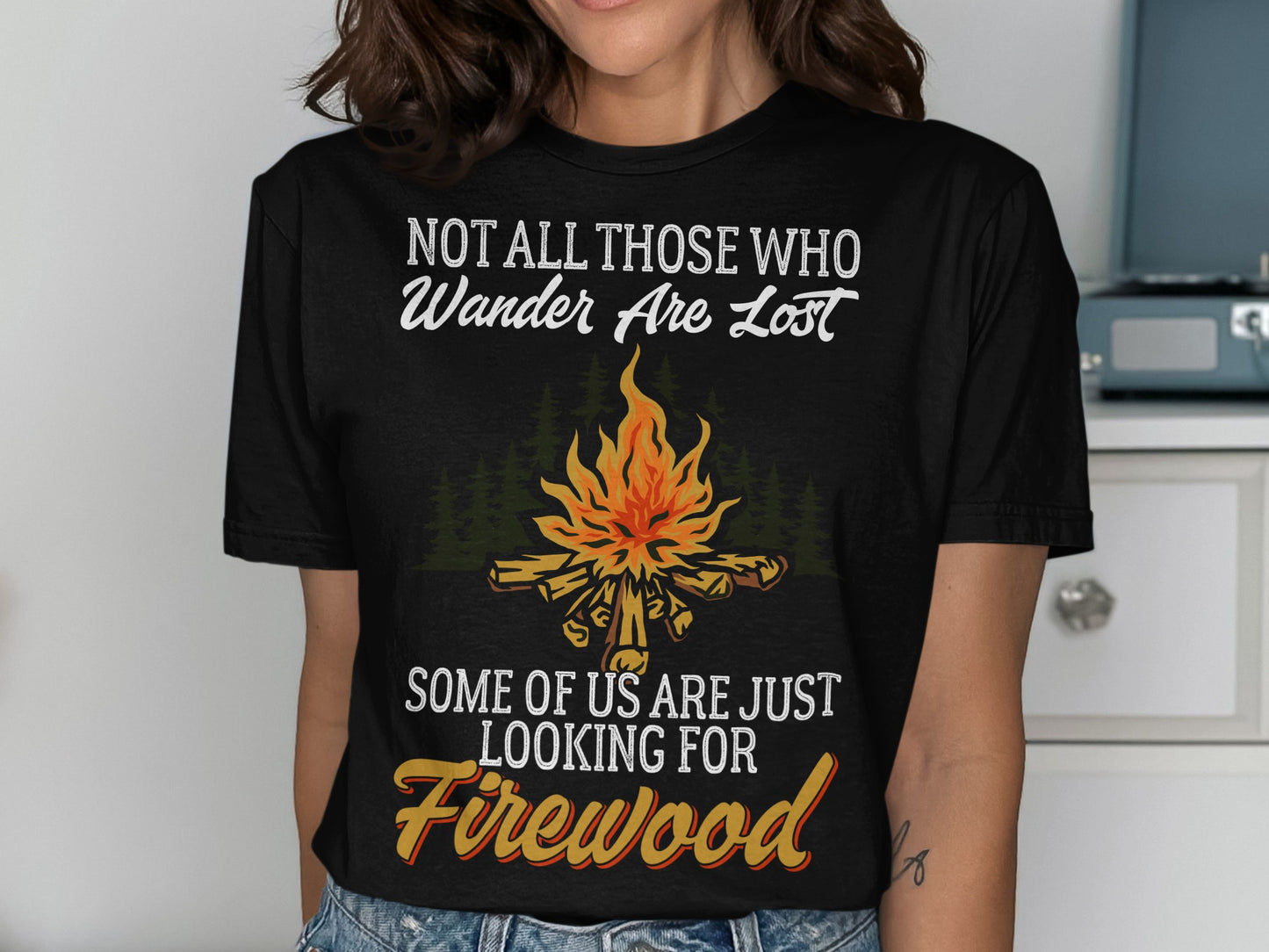 Black t-shirt with "Not All Those Who Wander Are Lost" and "Firewood" text.